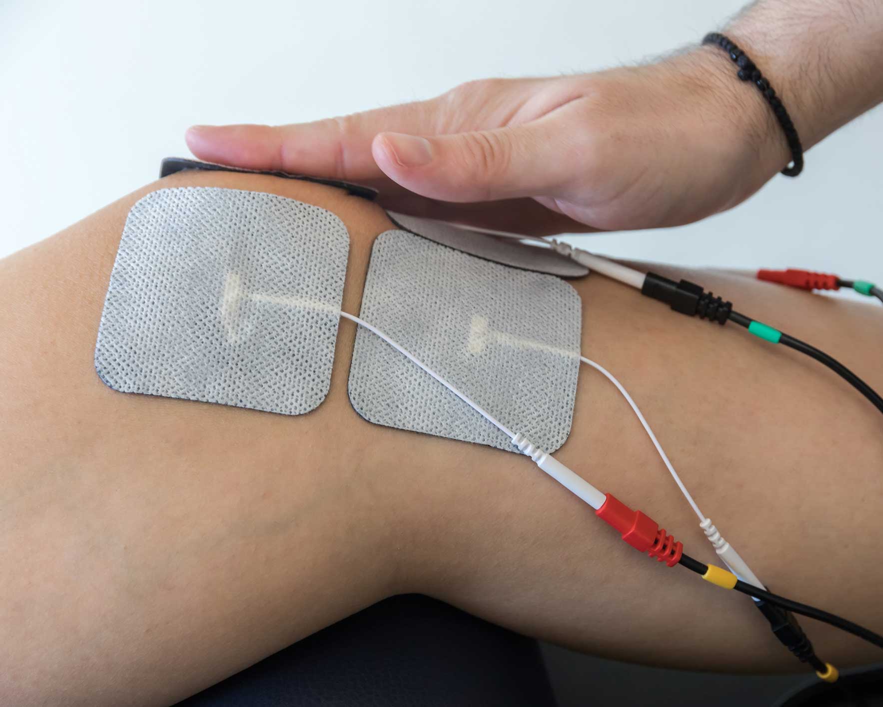 electronic therapy on knee used to treat pain